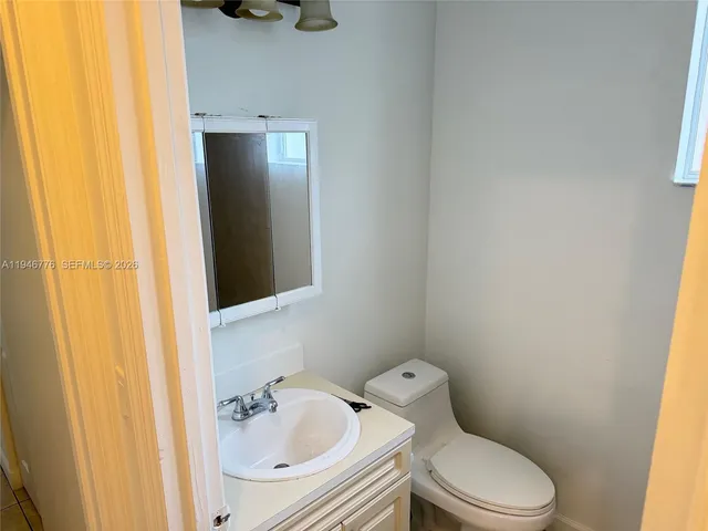 a bathroom with a toilet and a sink