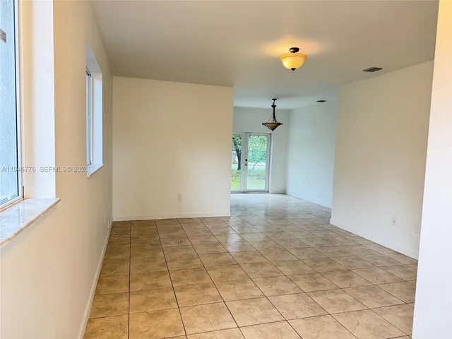 a view of an empty room and window