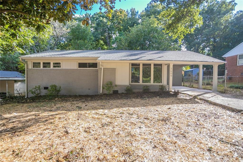 front view of a house with a yard