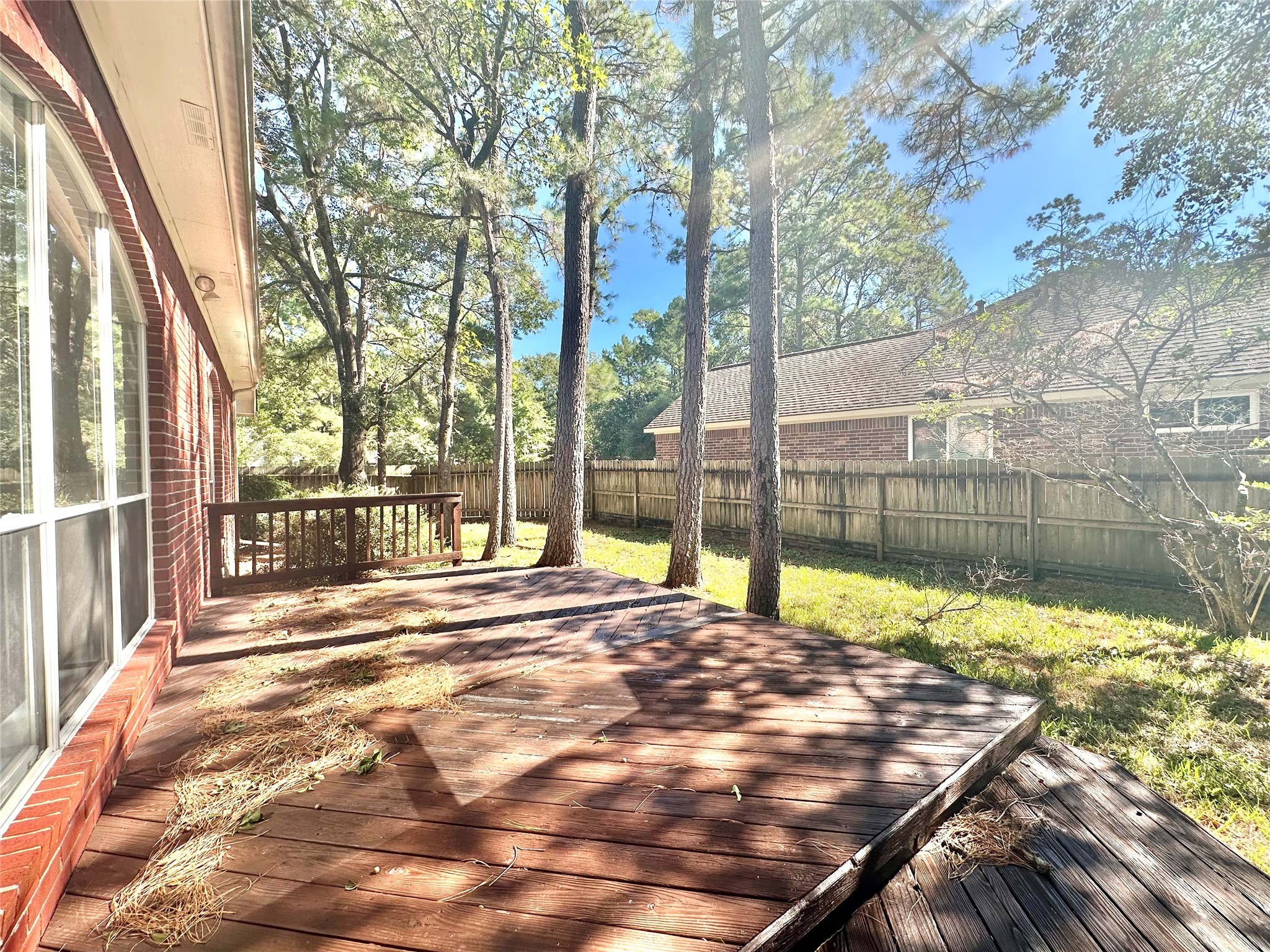 18 South Willow Point Circle Spring, TX 77382 - Photo 23 of 27 a view of backyard with wooden fence and large trees