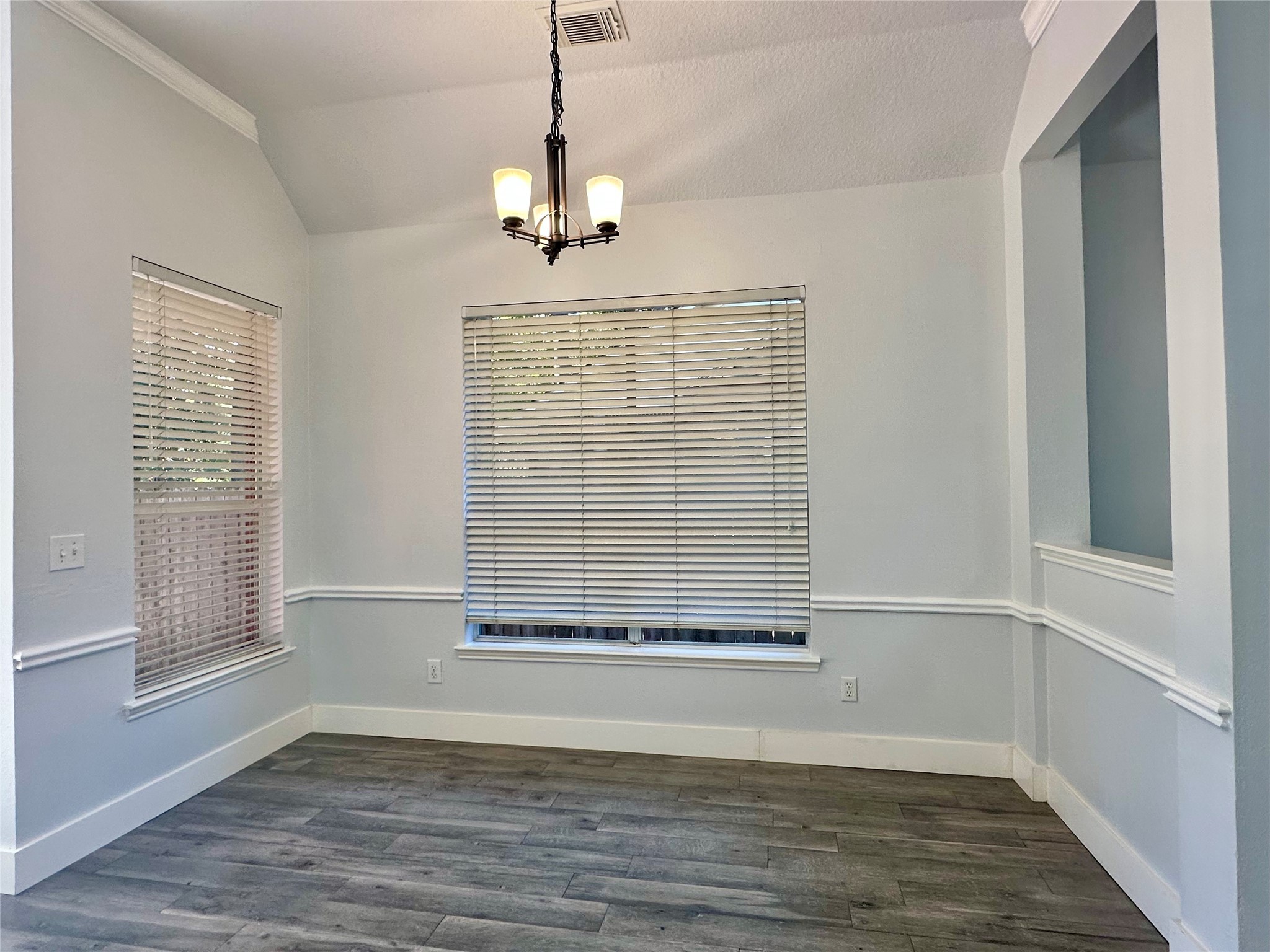 18 South Willow Point Circle Spring, TX 77382 - Photo 9 of 27 a view of an empty room with a window and wooden floor