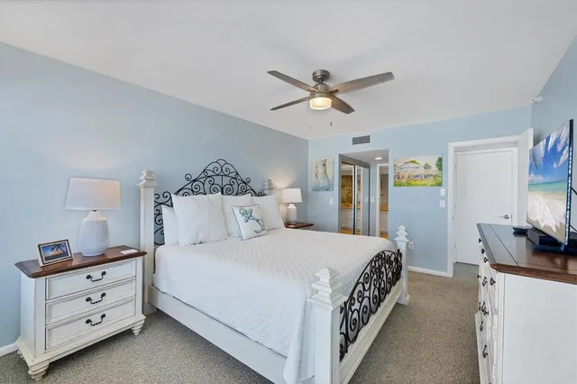 a bedroom with two beds and a window