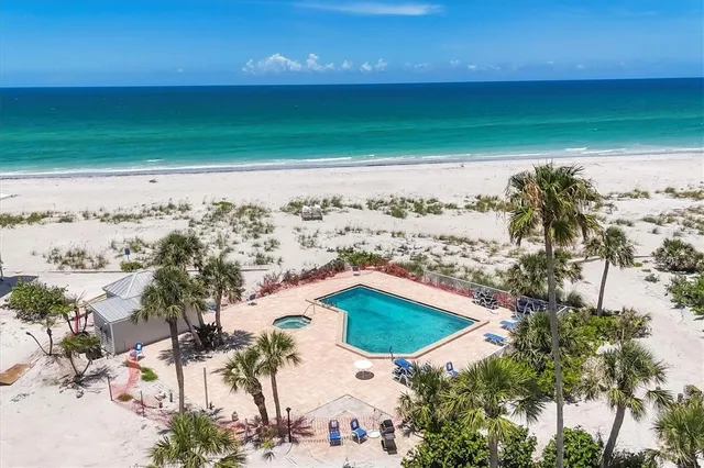 a view of a lake with houses in the background