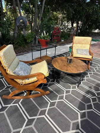 a patio with a table and chairs