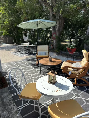 a view of a backyard with sitting area