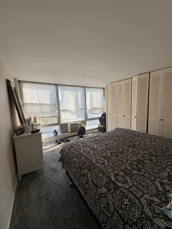 a bed room with a bed and a couch