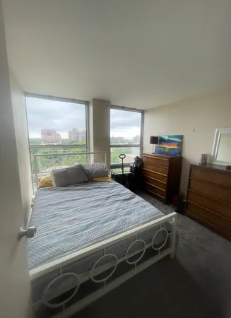 a kitchen view with wooden floor and windows
