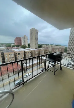a balcony with a table & chairs