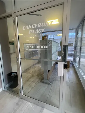a bathroom with a glass shower door