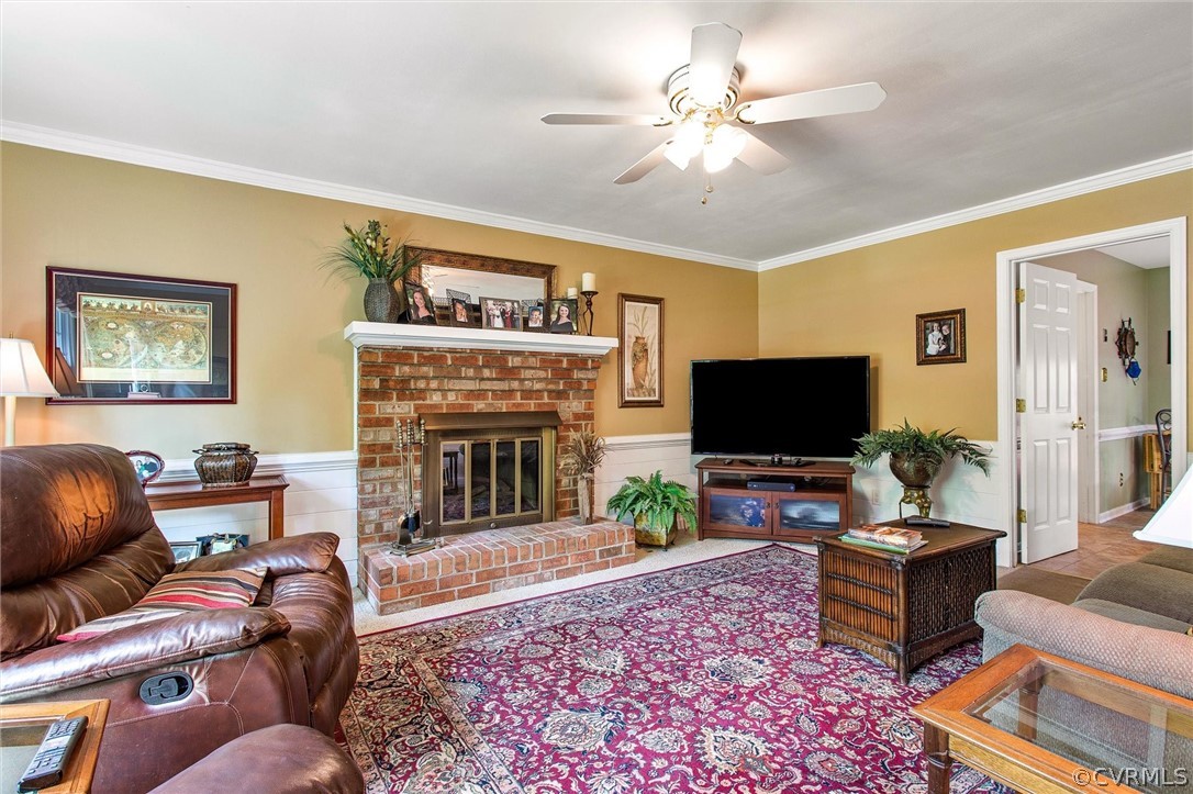14209 Long Gate Road Midlothian, VA 23112 - Photo 11 of 36 a living room with furniture a flat screen tv and a fireplace