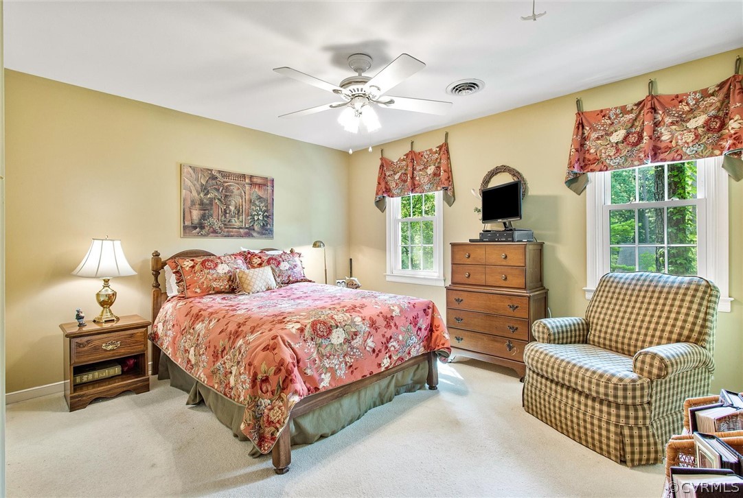 14209 Long Gate Road Midlothian, VA 23112 - Photo 26 of 36 a bedroom with a bed and a chandelier