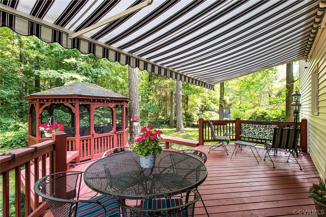 14209 Long Gate Road Midlothian, VA 23112 - Photo 32 of 36 a view of a chairs and table in the patio with a barbeque