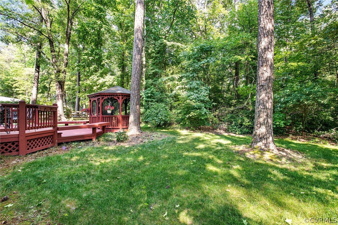 14209 Long Gate Road Midlothian, VA 23112 - Photo 33 of 36 a view of a wooden deck with chairs and a yard