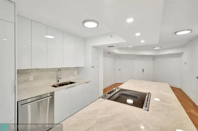 a bedroom with a bed and white cabinets