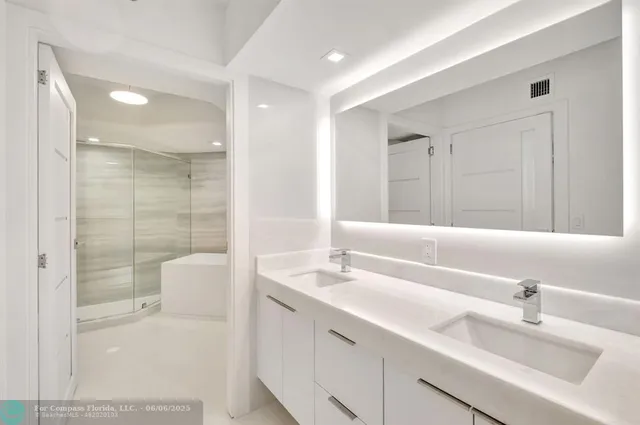 a bathroom with a shower and a bathtub