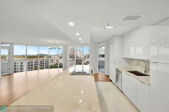 a large space with kitchen view and living room view