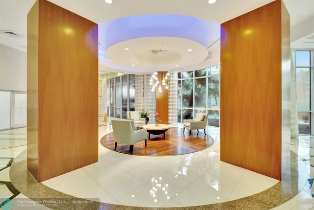 a view of a living room with a large window