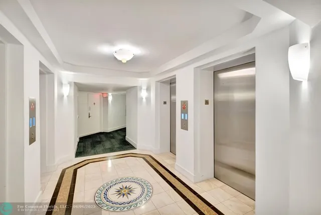 a view of bathroom with a tub and mirror