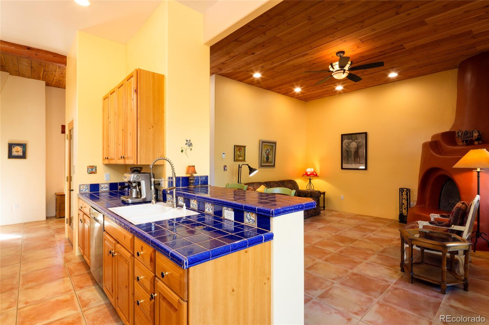 1329 Moonlight Way Crestone, CO 81131 - Photo 12 of 50 a kitchen with a stove and a view of living room