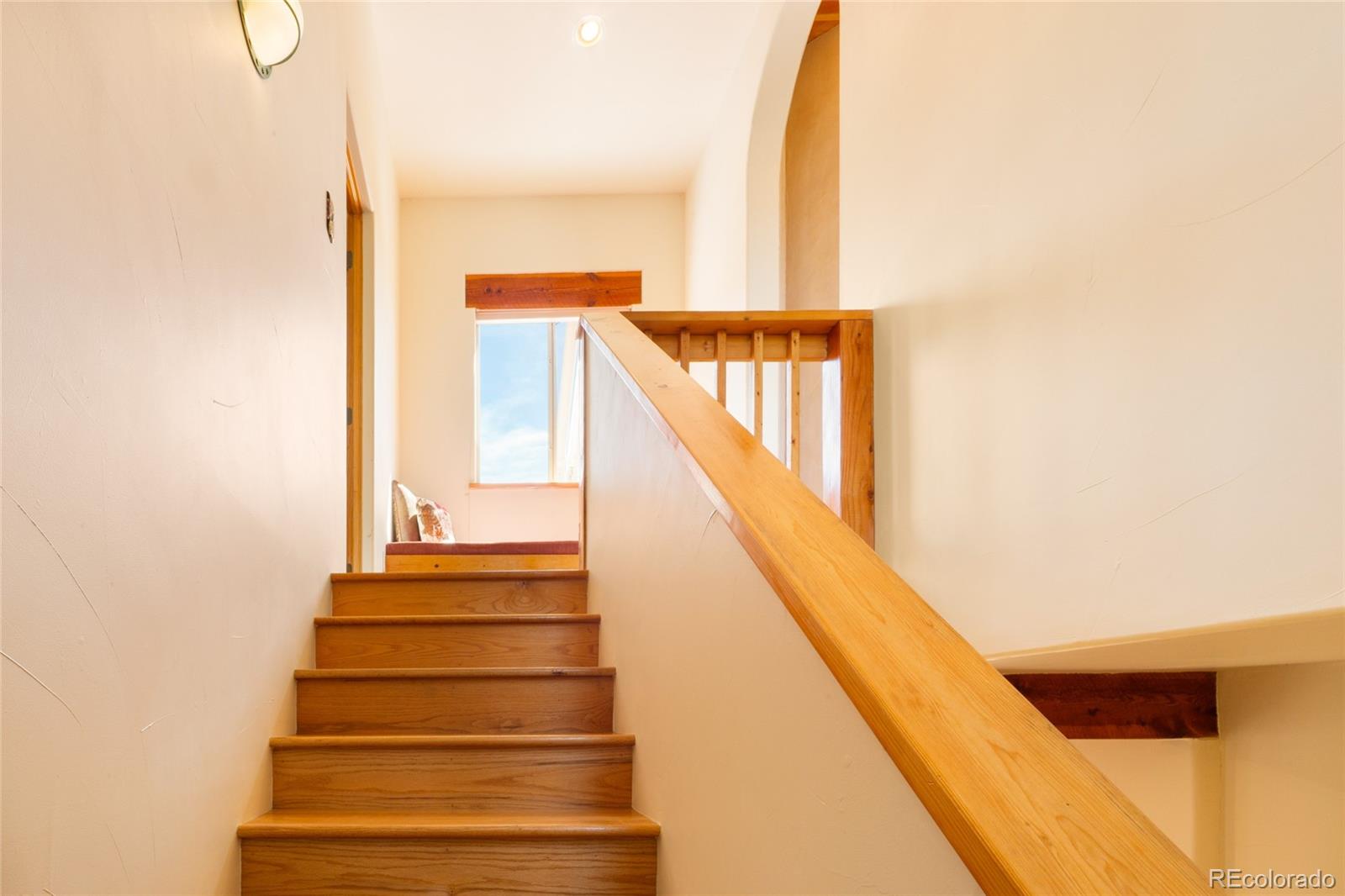 1329 Moonlight Way Crestone, CO 81131 - Photo 22 of 50 a view of staircase with white walls and a potted plants