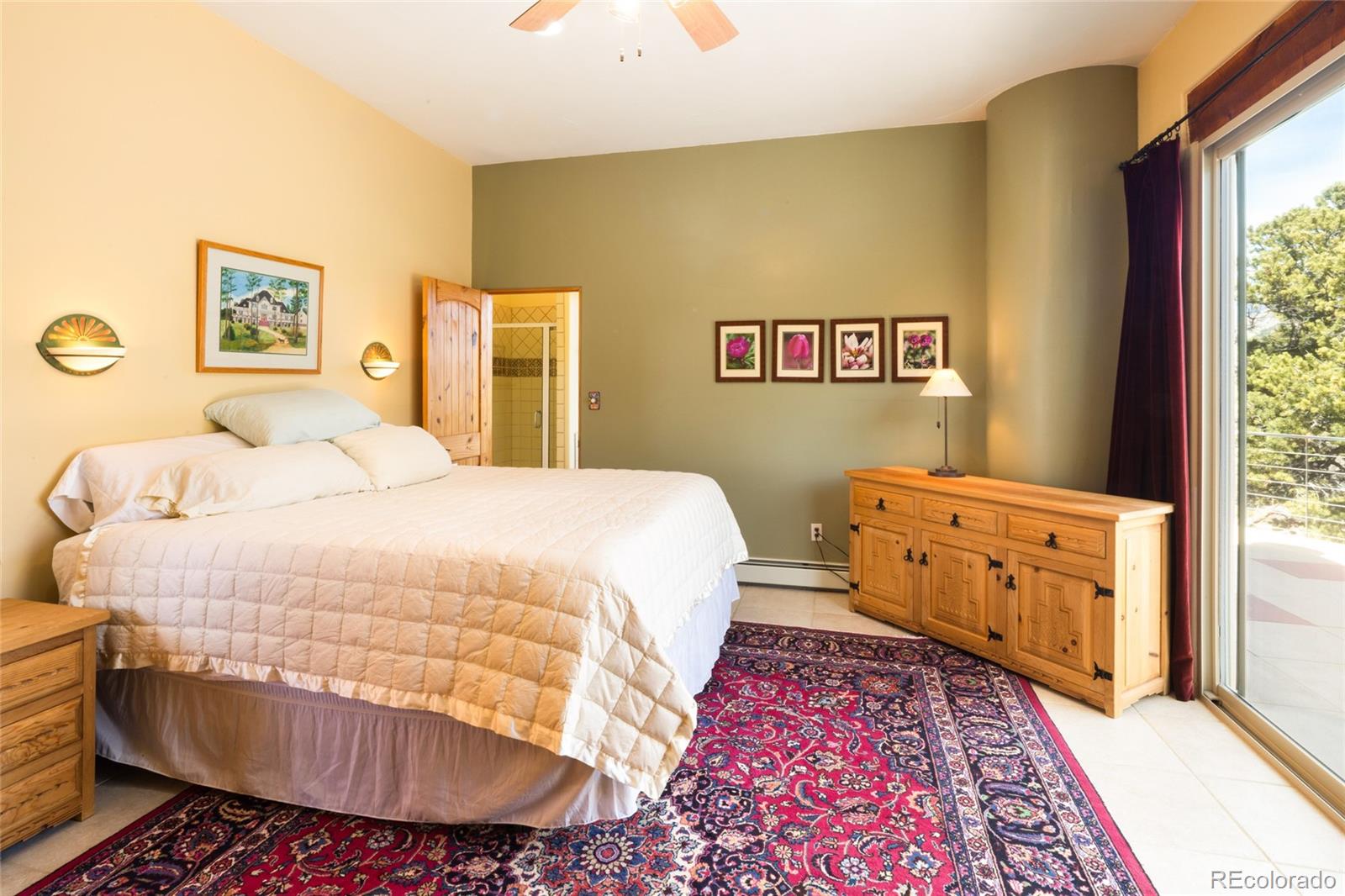 1329 Moonlight Way Crestone, CO 81131 - Photo 24 of 50 a bedroom with a bed and wooden floor