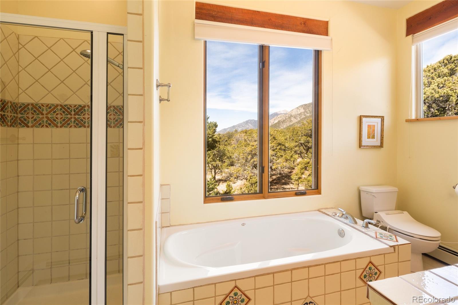 1329 Moonlight Way Crestone, CO 81131 - Photo 29 of 50 a bath tub sitting next to a blue shower