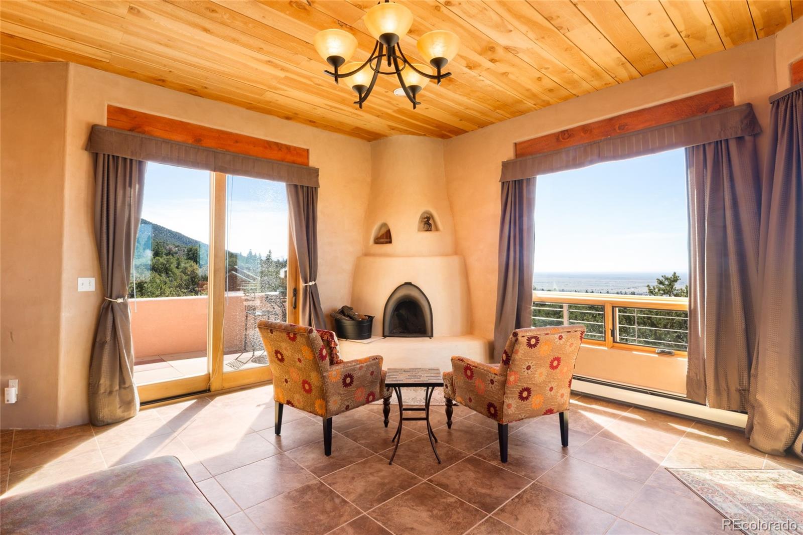 1329 Moonlight Way Crestone, CO 81131 - Photo 33 of 50 a view of a dining room with furniture window and outside view