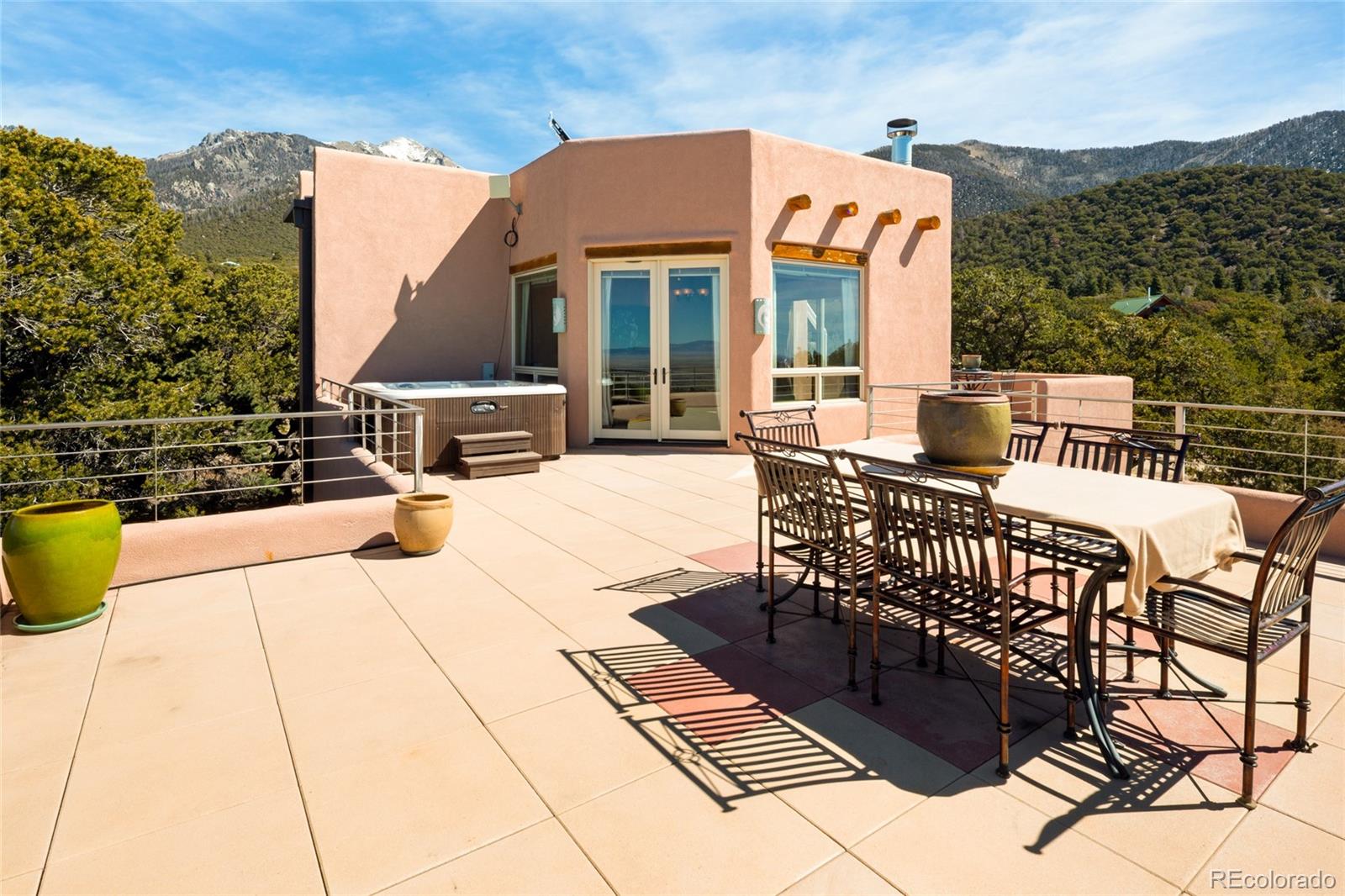 1329 Moonlight Way Crestone, CO 81131 - Photo 34 of 50 a view of a patio with couches table and chairs and potted plants