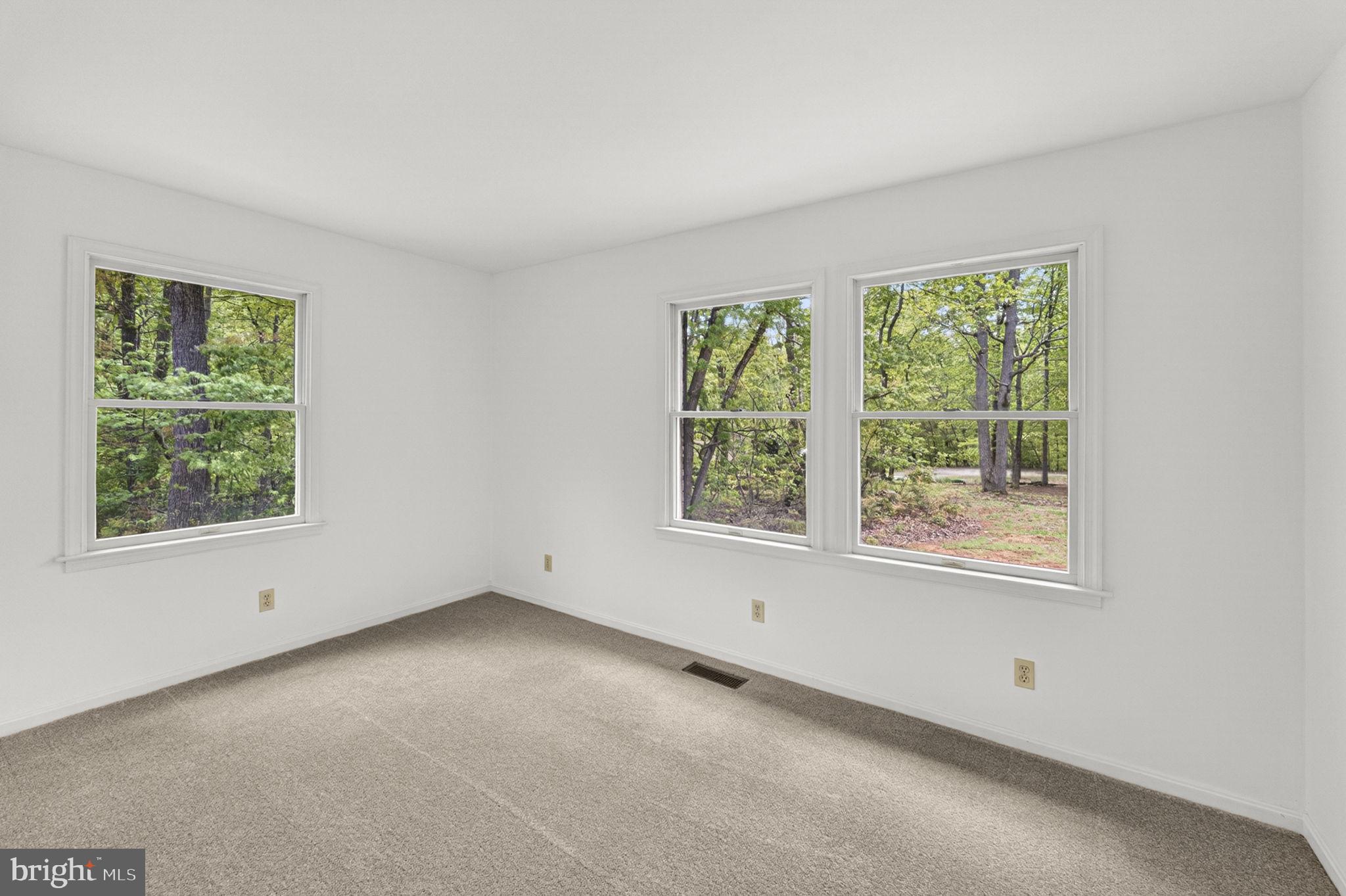 13047 Elk Run Road Bealeton, VA 22712 - Photo 43 of 58 Bedroom 2 with plenty of light and wooded views