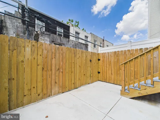 a view of a balcony with wooden fence