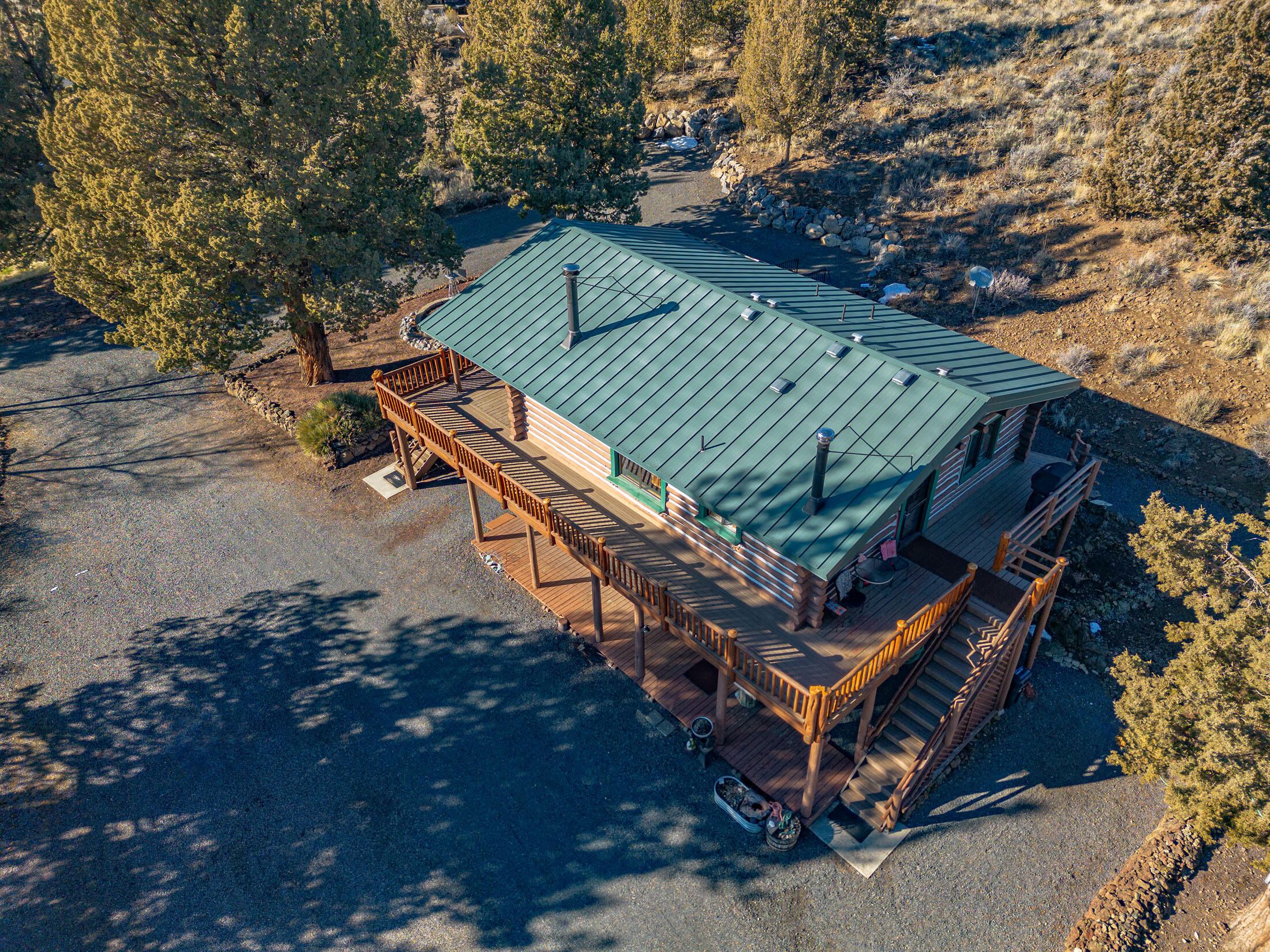 60384 Arnold Market Road Bend, OR 97702 - Photo 48 of 93 Whether you want sun or shade, this wrap-around deck is perfect.