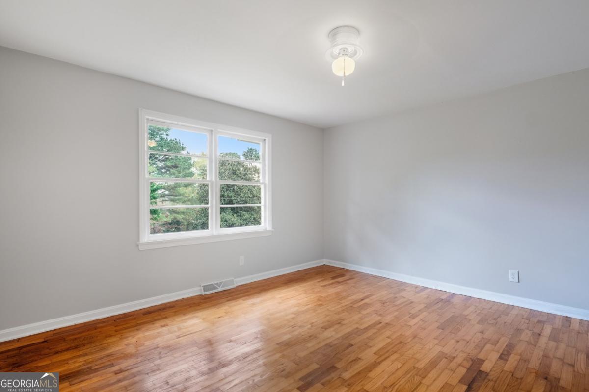14 Mitchell Circle Rome, GA 30161 - Photo 15 of 39 wooden floor in an empty room with a window