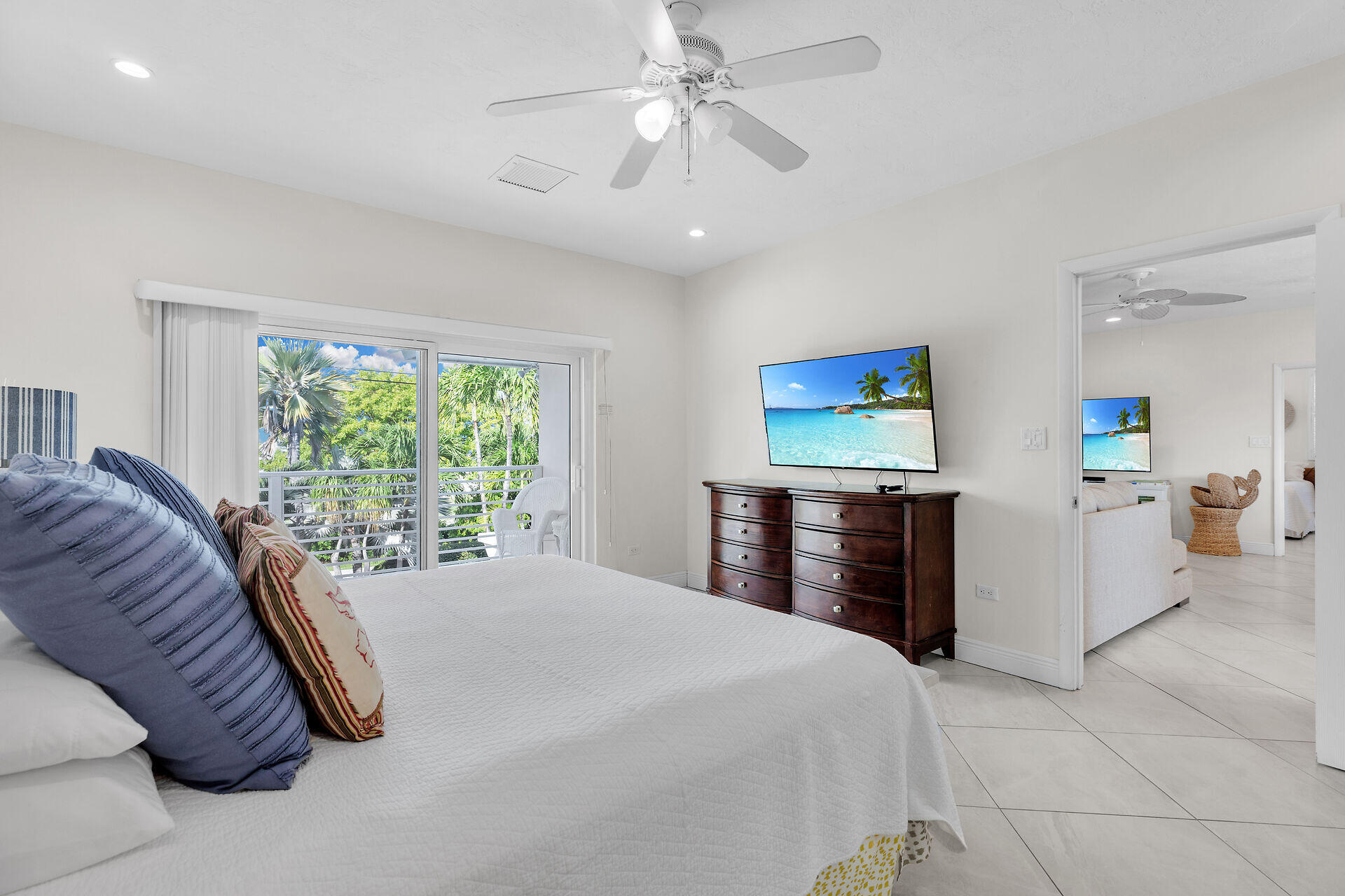1850 Manor Lane Marathon, FL 33050 - Photo 21 of 67 a bedroom with a bed and a chandelier