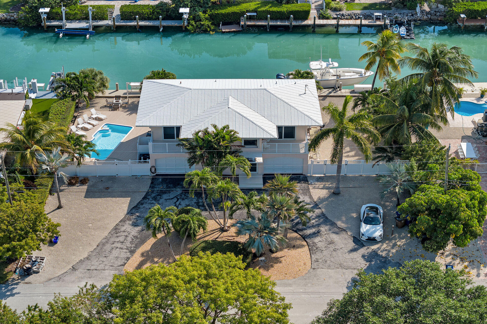 1850 Manor Lane Marathon, FL 33050 - Photo 3 of 67 an aerial view of a house with outdoor space and lake view