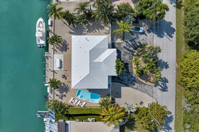 a view of a swimming pool and lounge chair