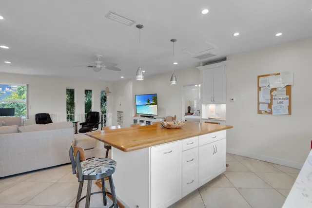 a kitchen with a sink stove and refrigerator