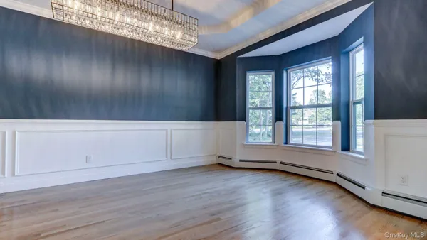 a large kitchen with stainless steel appliances granite countertop a sink stove and refrigerator