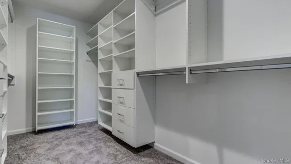 a bathroom with a granite countertop sink a toilet and bathtub
