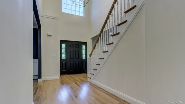 a view of entryway with wooden floor
