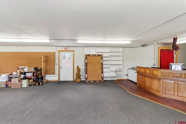 an empty room with furniture and a window