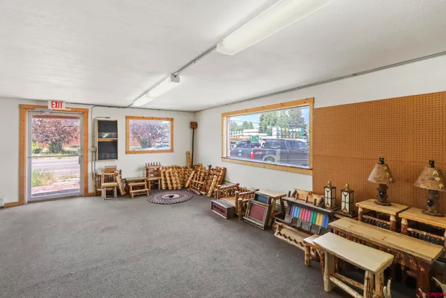 a room with furniture and a large window