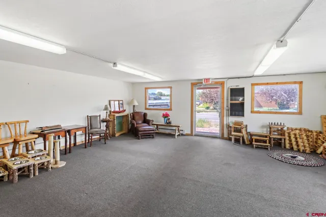 a view of a big room with furniture and toys