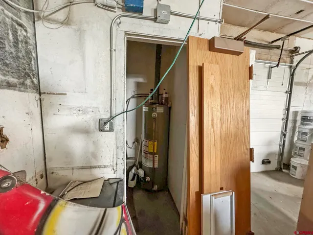 a bathroom with a toilet and a mirror
