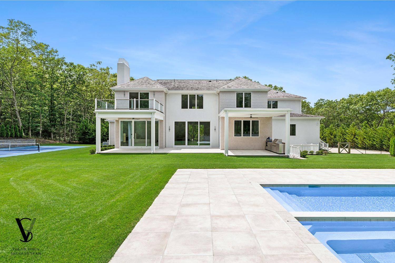 2061 Deerfield Road Sag Harbor, NY 11963 - Photo 2 of 33 a front view of a house with a yard