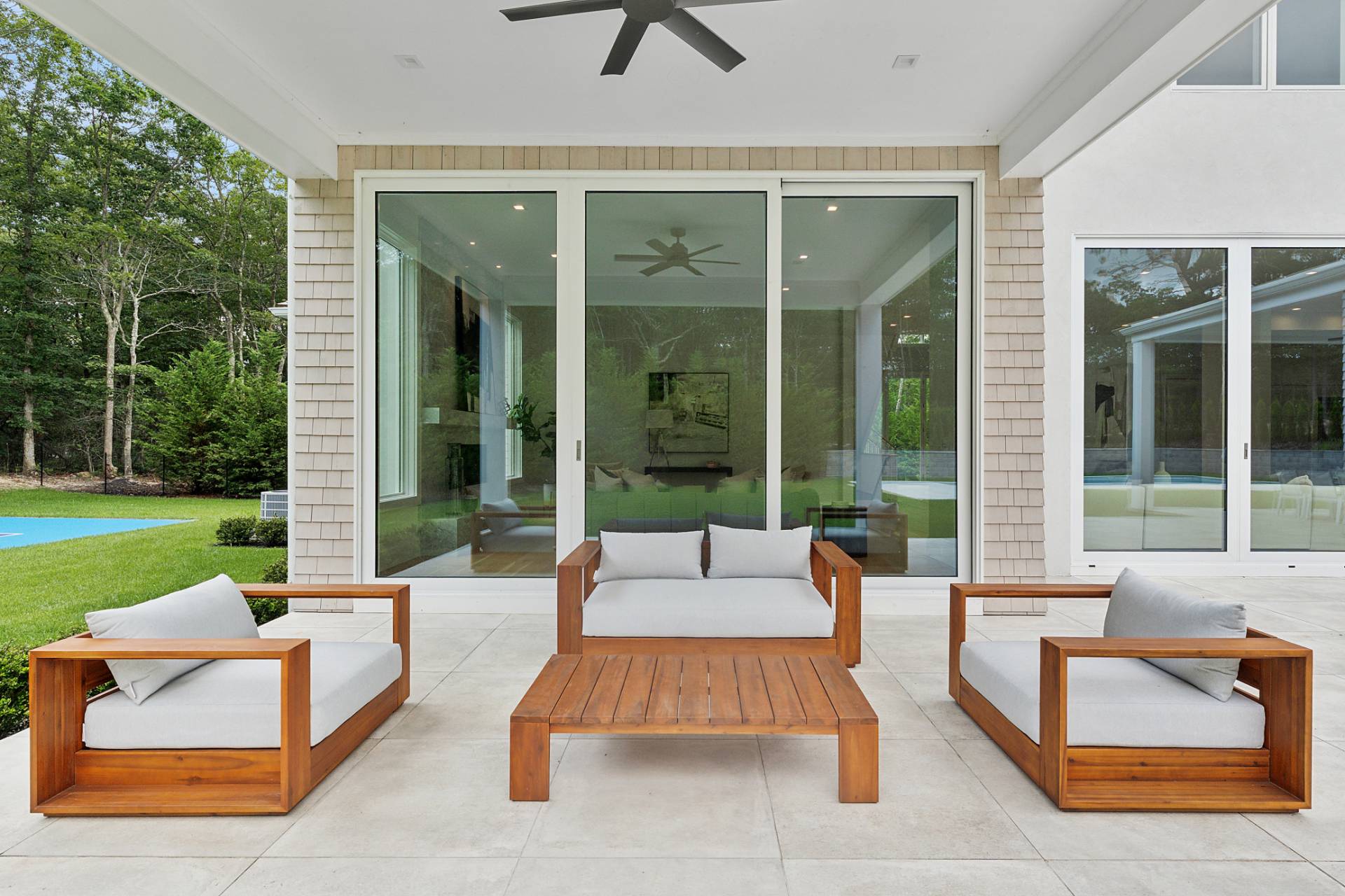 2061 Deerfield Road Sag Harbor, NY 11963 - Photo 25 of 33 a balcony with furniture and a garden