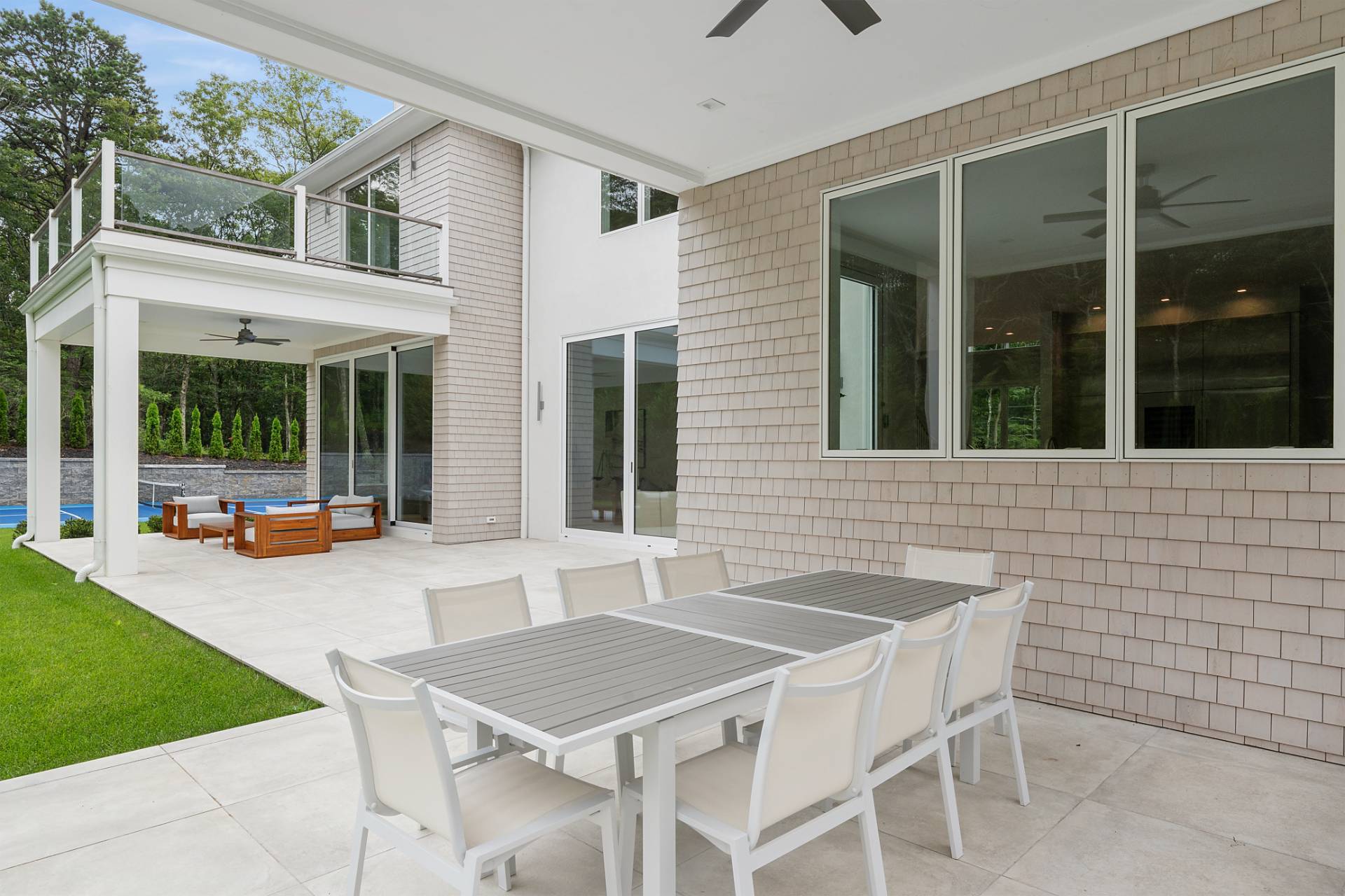 2061 Deerfield Road Sag Harbor, NY 11963 - Photo 27 of 33 a backyard of a house with table and chairs