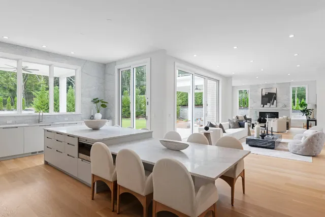 a large kitchen with a table and chairs in it