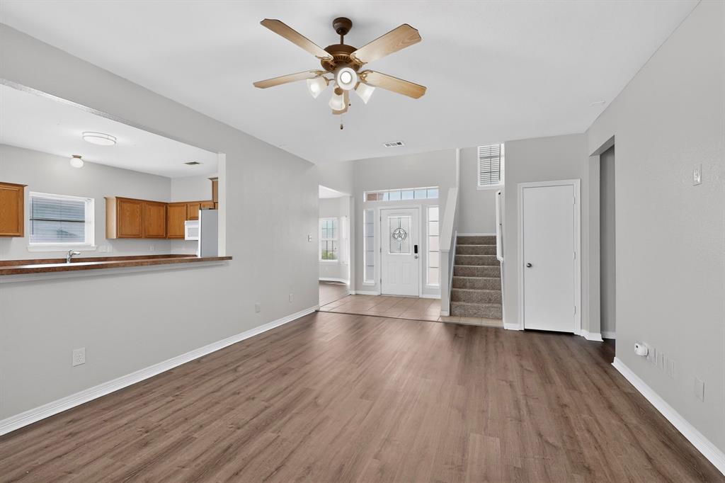 3401 Newgate Street Midlothian, TX 76065 - Photo 7 of 34 Spacious interior with wood-finish flooring, a ceiling fan, and a neutral color palette