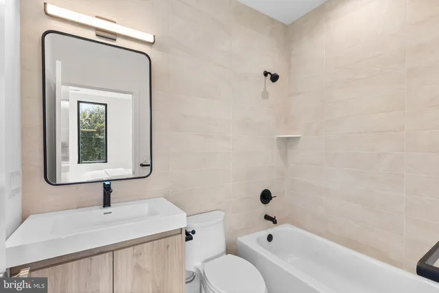 a bedroom with a bed and a chair