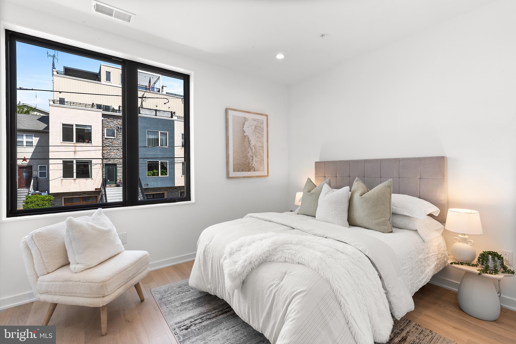 259 Delmar Street Philadelphia, PA 19128 - Photo 18 of 30 a bedroom with a bed and a chair